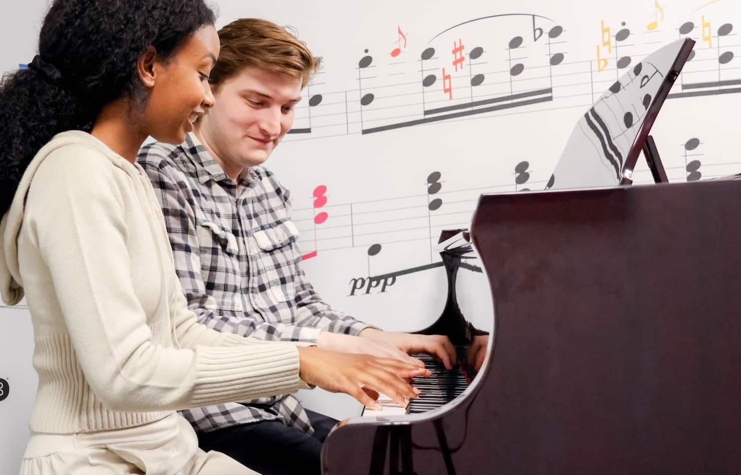 A student taking a lesson at NY Piano School.